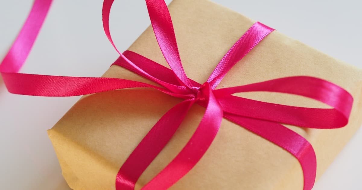 Person creating an online gift list on their laptop